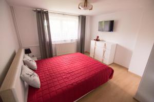 Posteľ alebo postele v izbe v ubytovaní Apartament Zacisze Tatr