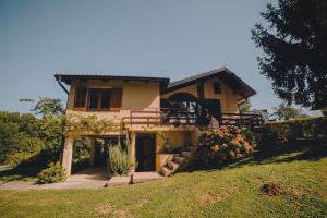 a house with a porch and stairs in a yard at Holiday Home Castanea in Praporčan