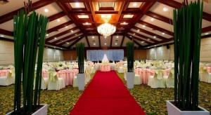 a banquet hall with tables and a red carpet at Pinehurst Golf Club and Hotel in Ban Bang Khan +120 photos