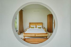 En eller flere senge i et værelse på Casa Blanca Villa