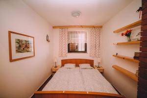 En eller flere senge i et værelse på Holiday Home Castanea