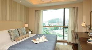 Ένα ή περισσότερα κρεβάτια σε δωμάτιο στο Somerset Software Park Xiamen +190 φωτογραφίες