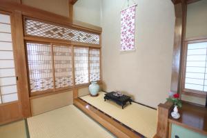 Postel nebo postele na pokoji v ubytování 塵表閣本店