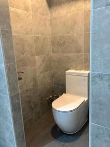 a bathroom with a white toilet and a shower at MET A Space Pod @ Chinatown in Singapore +84 photos