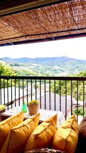 a table with pillows on a balcony with a view at Grace House Hill Paradise Atami in Atami +79 photos