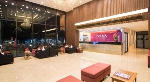a lobby with couches and chairs in a building at Viva Residence in Ban Baen Phichit +127 photos
