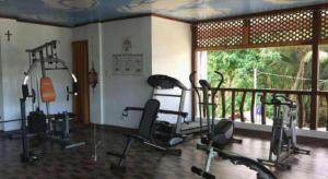 a gym with several exercise bikes in a room at Anda de Boracay in Bohol Hotel in Anda