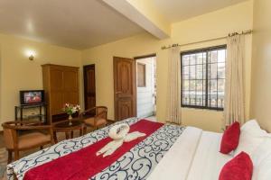 Giường trong phòng chung tại Hotel Norbu Sangpo +162 ảnh