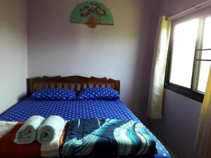 a bedroom with a bed with towels on it at หมอกอิงธาร รีสอร์ท เขาค้อ in Ban Khao Ya Nua +27 photos