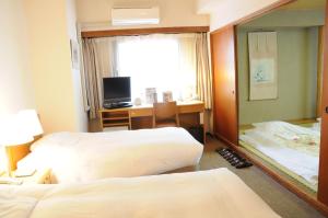 Postel nebo postele na pokoji v ubytování Hotel Terrace Yokohama