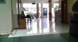 a room with a hallway with a table and chairs at Amarin Grand Hotel in Ban Choeng Noen +45 photos