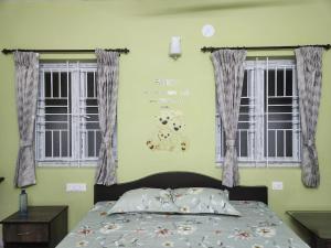 Postel nebo postele na pokoji v ubytování VPM Homestay