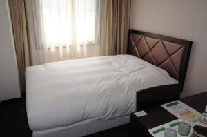 Postel nebo postele na pokoji v ubytování Hotel Terrace Yokohama