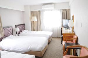Postel nebo postele na pokoji v ubytování Hotel Terrace Yokohama
