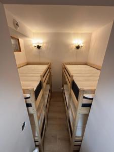 Postel nebo postele na pokoji v ubytování Appartement au pied des pistes