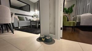 a living room with a dog bowl on the floor at KRUNA 406 Apartment in Becici