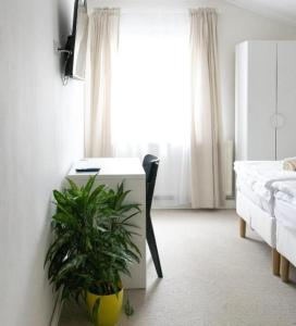 Postel nebo postele na pokoji v ubytování Hotel Sport Houštka