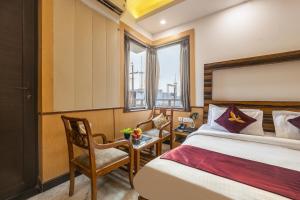 Un pat sau paturi într-o cameră la Hotel Admire Inn Sec - 44 By ASPL +45 fotografii