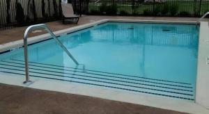 a large swimming pool with blue water in a building at Comfort Inn & Suites Tulsa I-44 West - Rt 66 in Sand Springs +86 photos