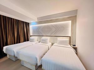 Postel nebo postele na pokoji v ubytování The Belagri Hotel and Convention + 176 fotografií