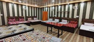 Postel nebo postele na pokoji v ubytování Shree Raghav Homestay