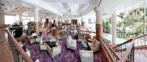 a view of a hotel lobby with a pool at Dorsett Grand Labuan in Labuan