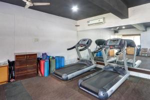 a gym with two tread machines in a room at Townhouse Kakinada Nagamalli Thota Junction in Kākināda