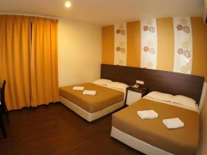 Ένα ή περισσότερα κρεβάτια σε δωμάτιο στο Cukai View Hotel +64 φωτογραφίες