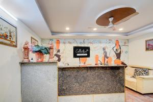 a bar in a room with a couch at Collection O Hyderabad Hitech City Formerly Night Eye in Hyderabad