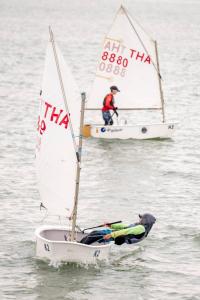 two small sailboats in the water with people in them at Jansom Beach Resort in Ranong +62 photos