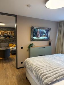 En eller flere senge i et værelse på Suite Bellevue + 13 billeder