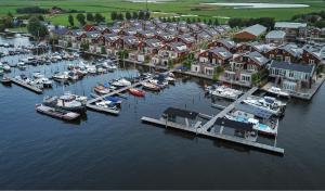 an aerial view of a marina with boats in the water at Houseboat Uitgeest on the Water | 4 people in Uitgeest +14 photos