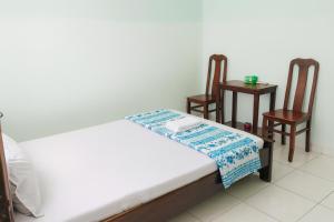 Giường trong phòng chung tại Thanh Tùng Hotel HCM +21 ảnh