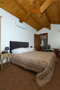 Tempat tidur dalam kamar di Il Casale Del Giglio