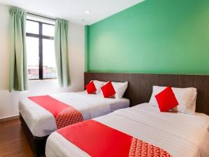 Postel nebo postele na pokoji v ubytování OYO 89487 SPACE HOTEL