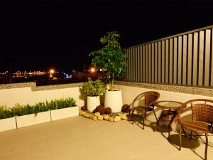 Un patio sau altă zonă în aer liber la Hotian Inn