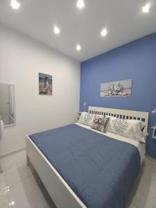 Postel nebo postele na pokoji v ubytování MaMmaRosa Ortigia, historic city of Syracuse + 16 fotografií