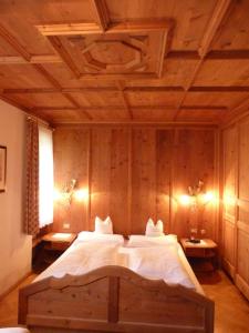 Postel nebo postele na pokoji v ubytování Chalet Ciasa Alexander