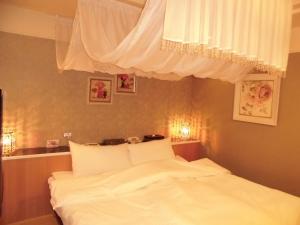 Postel nebo postele na pokoji v ubytování Hotel D.D