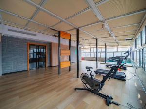 a gym with two exercise bikes in a room at City Comfort Inn Wuhan Jianghan Road Jiali Square in Wuhan