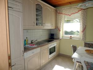Kuchyň nebo kuchyňský kout v ubytování Gästehaus Am Hirtenberg