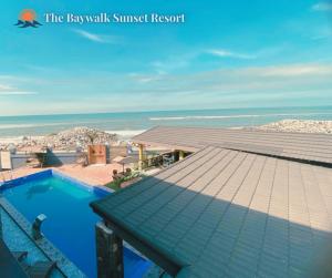a view of the beach from the roof of a resort at The Baywalk Sunset Resort in Agoo