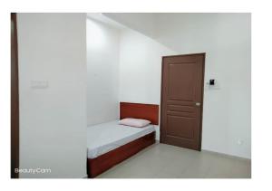 Una cama o camas en una habitación de Pangkor Villa Jia Yuan 邦咯岛家苑海滩别墅