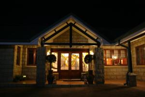 a front door of a house at night at Mt Horeb Manor in Clarens