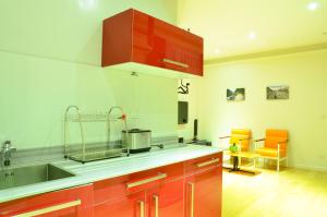 a kitchen with a sink and a counter top at Maderla in Bangkok