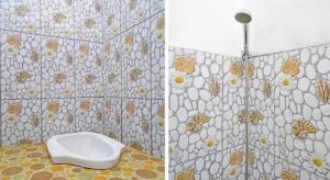 a bathroom with a toilet and a tiled wall at SPOT ON 91993 Pondok Hs Padalarang Syariah in Simpar