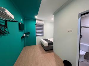 En eller flere senge i et værelse på Alami Garden Hotel Kuala Lumpur + 40 billeder