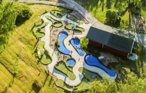 an overhead view of a water park with many slides at Cozy Home In Myggenäs With Sauna in Höviksnäs +24 photos