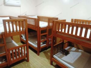 En eller flere senge i et værelse på MD's Transient and Staycation Tagaytay