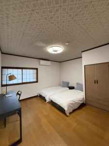Ένα ή περισσότερα κρεβάτια σε δωμάτιο στο 桜Sakura